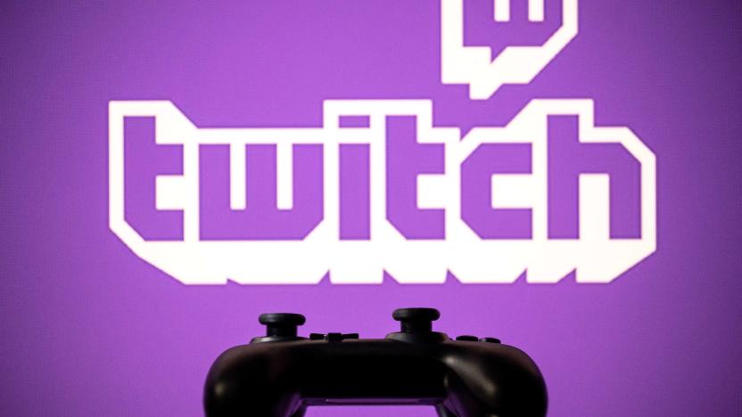 A gamepad is pictured as a screen displays the online Twitch plateform in Toulouse, southwestern France, on June 15, 2021. (Photo by Lionel BONAVENTURE / AFP) (Photo by LIONEL BONAVENTURE/AFP via Getty Images)