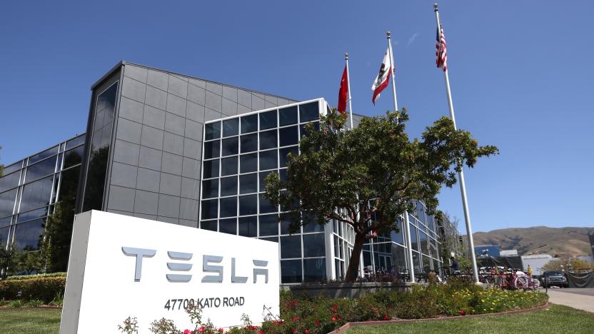 FREMONT, CALIFORNIA - APRIL 20: A sign is posted in front of a Tesla office on April 20, 2022 in Fremont, California. Tesla reported first quarter earnings that far exceeded analyst expectations with revenue of $18.76 billion compared to expectations of $17.80 billion. (Photo by Justin Sullivan/Getty Images)