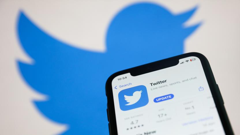 Twitter on App Store displayed on a phone screen and Twitter logo displayed on a screen in the background are seen in this illustration photo taken in Krakow, Poland on November 22, 2022. (Photo by Jakub Porzycki/NurPhoto via Getty Images)