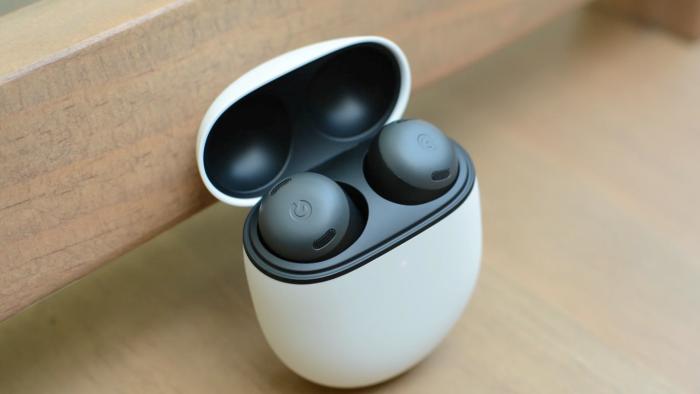 An image of Google's earbuds on a table. 