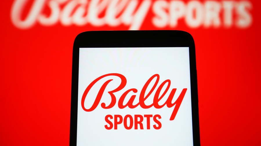 Getty Images - UKRAINE - 2023/03/15: In this photo illustration, Bally Sports logo is seen on a smartphone and on a pc screen. (Photo Illustration by Pavlo Gonchar/SOPA Images/LightRocket via Getty Images)