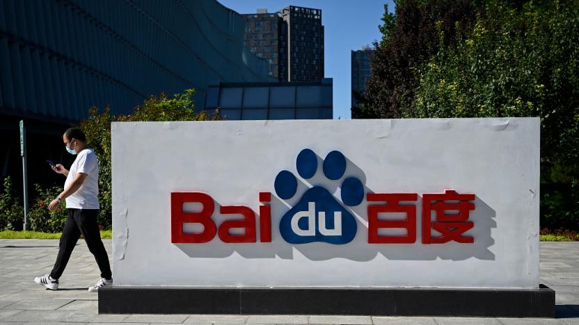 An employee walks past the company logo at Baidu's headquarters in Beijing on September 6, 2022. (Photo by Jade GAO / AFP) (Photo by JADE GAO/AFP via Getty Images)