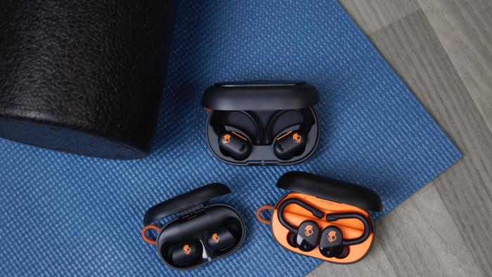 Skullcandy Active Collection, showing three sets of earbuds inside their charging cases.