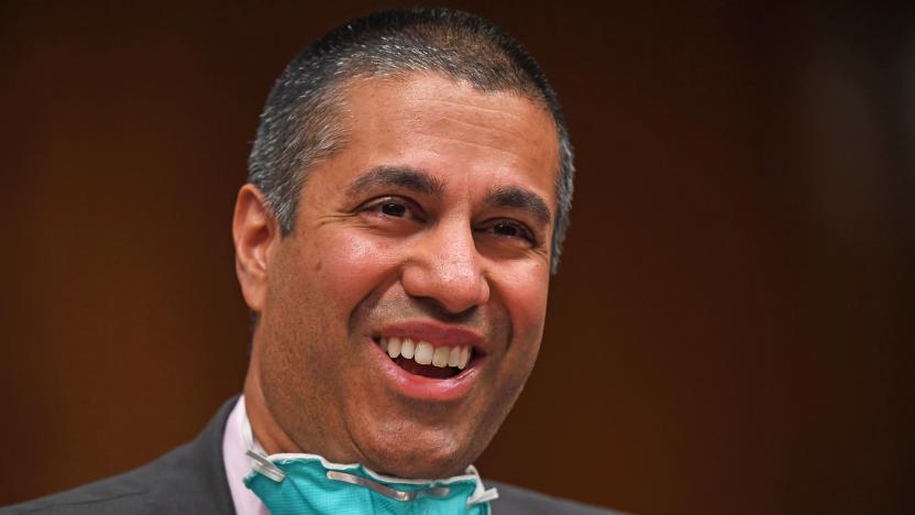 Ajit Pai, the FCC head, seen laughing.