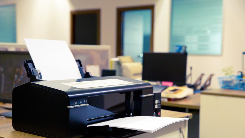 Laser Printer on the table in Office.