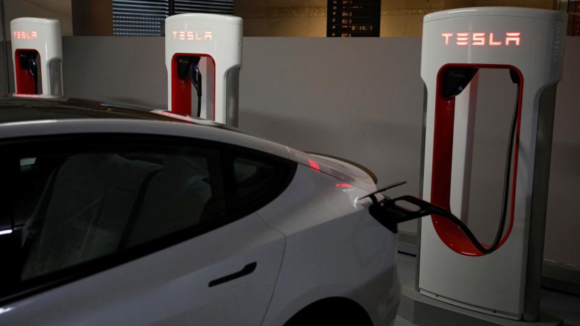 A Tesla car charges at a Supercharger station in Singapore October 22, 2021. Picture taken October 22, 2021. REUTERS/Edgar Su