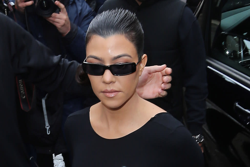 Kourtney Kardashian defends the use of pajamas for dinner in satin set and high heels