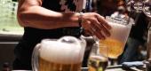 A bartender pours beer. (Getty Images)