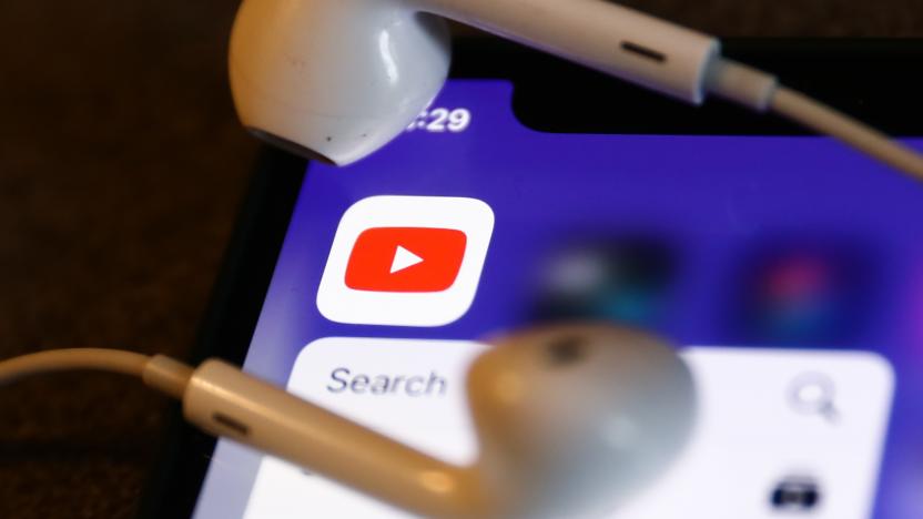 YouTube icon displayed on a phone and headphones are seen in this illustration photo taken in Krakow, Poland on August 22, 2022. (Photo by Jakub Porzycki/NurPhoto via Getty Images)