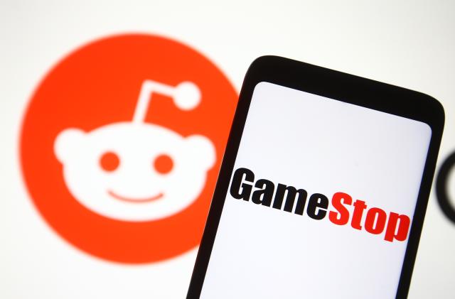 UKRAINE - 2021/02/05: In this photo illustration a GameStop logo is seen on a mobile phone screen in front of Reddit logo. (Photo Illustration by Pavlo Gonchar/SOPA Images/LightRocket via Getty Images)