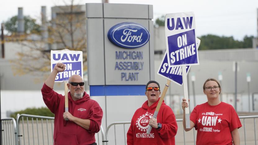 United Auto Workers members walk the picket line at the Ford Michigan Assembly Plant in Wayne, Mich., Tuesday, Sept. 26, 2023. (AP Photo/Paul Sancya)