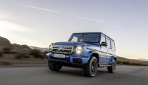 A blue all-terrain vehicle on the road.