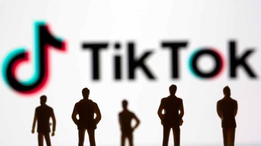 Small toy figures are seen in front of TikTok logo in this illustration picture taken March 15, 2021. REUTERS/Dado Ruvic/Illustration