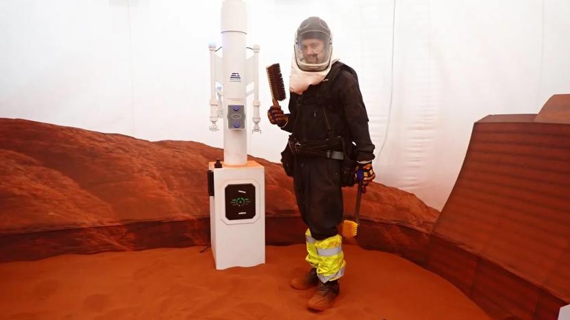 Nathan Jones stands inside the simulated Mars environment in a 1200-square-foot sandbox attached to the 3D printed habitat