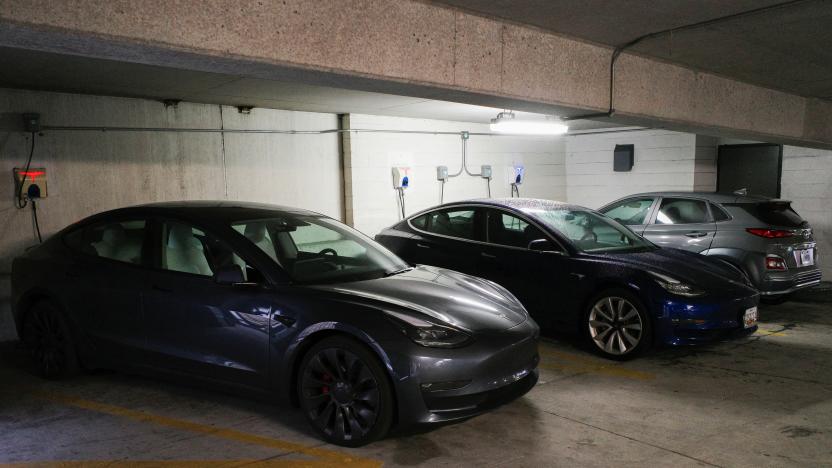 Tesla and Hyundai electric vehicles (EVs) charge at EV charging stations inside a parking garage owned by the City of Baltimore, Maryland, U.S., March 23, 2023. REUTERS/Bing Guan