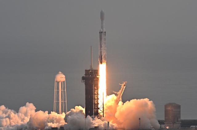 TOPSHOT - A SpaceX Falcon Heavy rocket with the Psyche spacecraft launches from NASA's Kennedy Space Center in Cape Canaveral, Florida, on October 13, 2023. The spacecraft is bound for Psyche, an object 2.2 billion miles (3.5 billion kilometers) away that could offer clues about the interior of planets like Earth. (Photo by CHANDAN KHANNA / AFP) (Photo by CHANDAN KHANNA/AFP via Getty Images)