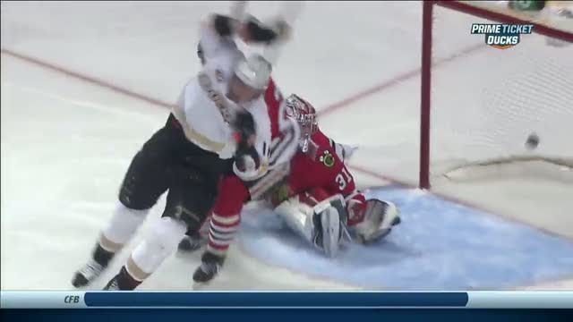 Corey Perry fights two checks for tip-in