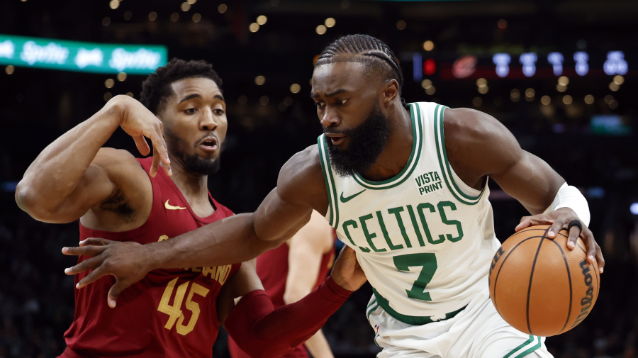 Getty Images - Boston, MA - December 14: Boston Celtics SG Jaylen Brown drives against Cleveland Cavaliers SG Donovan Mitchell in the first quarter. The Celtics beat the Cavaliers, 116-107. (Photo by Danielle Parhizkaran/The Boston Globe via Getty Images)