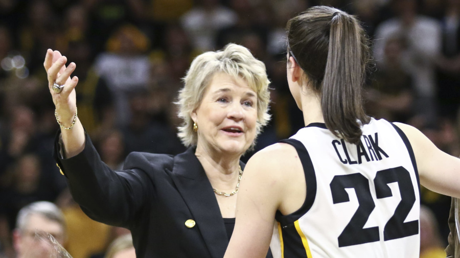Getty Images - IOWA CITY, IOWA- MARCH 3: Head coach Lisa Bluder (L) and associate head coach Jan Jensen (R) of the Iowa Hawkeyes hug guard Caitlin Clark #22 during the senior day program following the match-up against the Ohio State Buckeyes at Carver-Hawkeye Arena on March 3, 2024 in Iowa City, Iowa. (Photo by Matthew Holst/Getty Images)