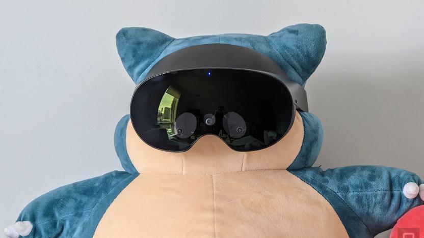 A Snorlax plush wearing the Meta Quest Pro. 