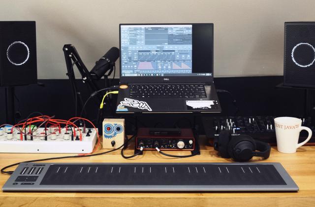 Roli Seaboard Rise 2 on my desk with some other music gadgets and my grandfather's coffee mug. 