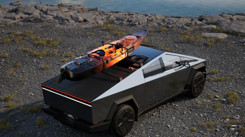 A silver vehicle with a canoe on its roof. 