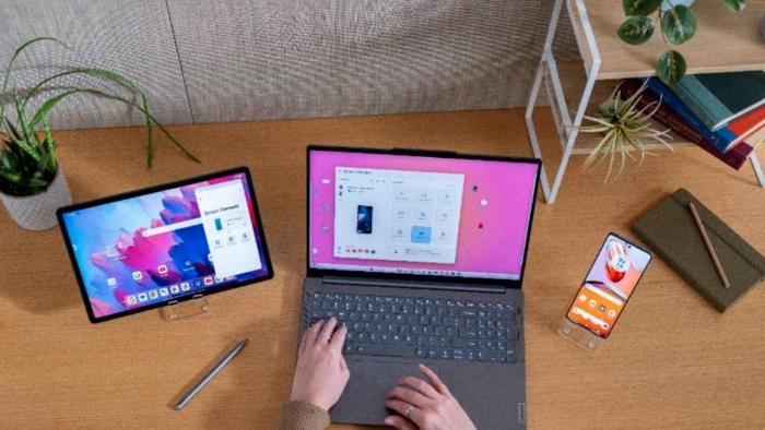 A Lenovo ThinkPad next to a tablet and smartphone. 