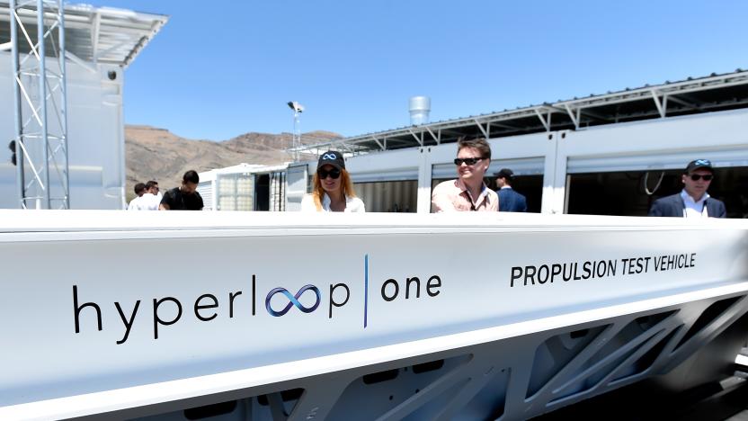 NORTH LAS VEGAS, NV - MAY 11:  People look at a demostration test sled after the first test of the propulsion system at the Hyperloop One Test and Safety site on May 11, 2016 in North Las Vegas, Nevada. The company plans to create a fully operational hyperloop system by 2020.  (Photo by David Becker/Getty Images,)