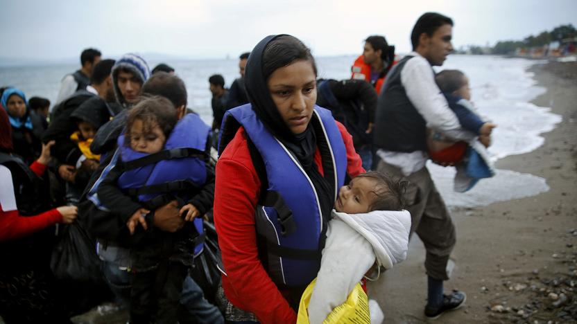 Afghan immigrants land at a beach on the Greek island of Kos after crossing a portion of the south-eastern Aegean Sea between Turkey and Greece on a dinghy early May 27, 2015. Despite the bad weather at least a dingy with over thirty migrants made the dangerous voyage to Greece. REUTERS/Yannis Behrakis      TPX IMAGES OF THE DAY     