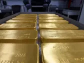 Gold prices step back after climbing to record high