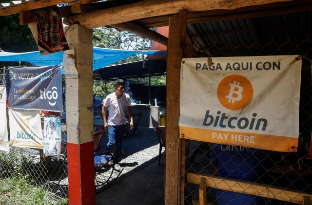 Bitcoin banners are seen outside of a small restaurant at El Zonte Beach in Chiltiupan, El Salvador June 8, 2021. REUTERS/Jose Cabezas