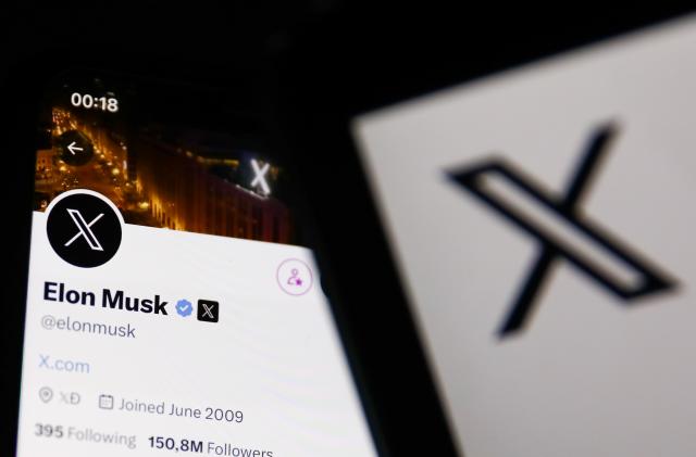 Elon Musk account on Twitter X displayed on a phone screen and Twitter X logo displayed on a laptop screen are seen in this illustration photo taken in Krakow, Poland on August 1, 2023. (Photo by Jakub Porzycki/NurPhoto via Getty Images)