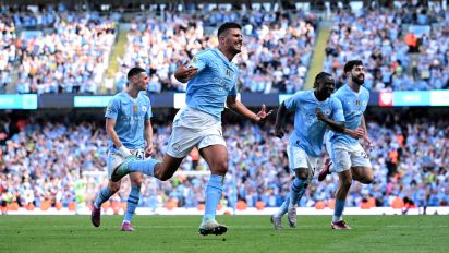 Getty Images - Manchester City's Spanish midfielder #16 Rodri (L) celebrates scoring the team's third goal during the English Premier League football match between Manchester City and West Ham United at the Etihad Stadium in Manchester, north west England, on May 19, 2024. (Photo by Oli SCARFF / AFP) / RESTRICTED TO EDITORIAL USE. No use with unauthorized audio, video, data, fixture lists, club/league logos or 'live' services. Online in-match use limited to 120 images. An additional 40 images may be used in extra time. No video emulation. Social media in-match use limited to 120 images. An additional 40 images may be used in extra time. No use in betting publications, games or single club/league/player publications. /  (Photo by OLI SCARFF/AFP via Getty Images)