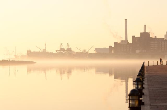 Baltimore, Maryland, United States - April 24, 2011: Inner Harbor, port facilities and industries at dawn.