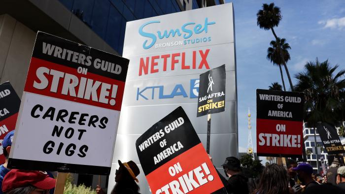 LOS ANGELES, CALIFORNIA - SEPTEMBER 22: Striking WGA (Writers Guild of America) members picket with striking SAG-AFTRA members outside Netflix studios on September 22, 2023 in Los Angeles, California. The Writers Guild of America and Alliance of Motion Picture and Television Producers (AMPTP) are reportedly meeting for a third straight day today in a new round of contract talks in the nearly five-months long writers strike.  (Photo by Mario Tama/Getty Images)