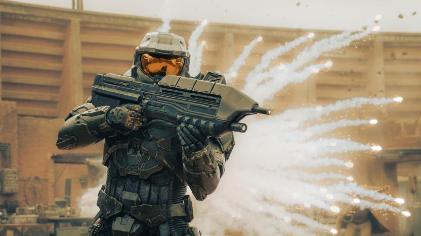 A still from the Halo TV series, showing Master Chief wielding a Battle Rifle with an explosion behind him.