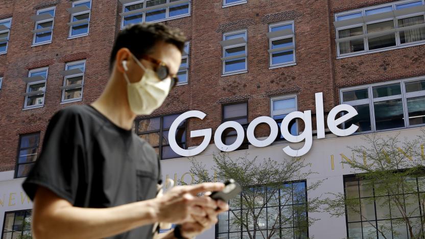 NEW YORK - NEW YORK - APRIL 13: A man checks his phone near a Google Corporate Office on April 13, 2021 in New York. More than 300 corporates including Google and Mc Donalds are pushing the Biden administration to almost double the United States target for cutting the planet warming emissions, ahead global summit on climate change in 2021. (Photo by John Smith/VIEWpress)