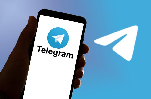 SPAIN - 2022/10/17: In this photo illustration, the online chat and communication app Signal Telegram logo seen displayed on a mobile phone and on a laptop. (Photo Illustration by Davide Bonaldo/SOPA Images/LightRocket via Getty Images)