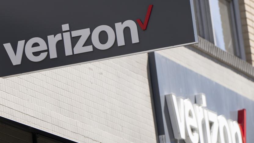 Signs are displayed outside a Verizon retail location on Tuesday, May 14, 2024, in Portland, Ore. (AP Photo/Jenny Kane)