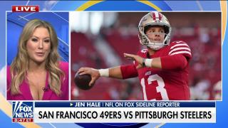 Fox Sports NFL sideline reporter Jen Hale prepares to go on the