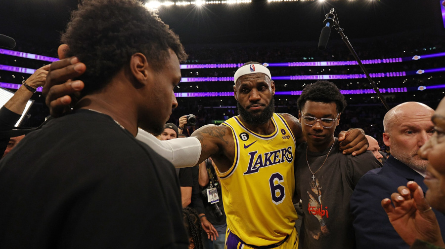 Getty Images - LOS ANGELES, CALIFORNIA - FEBRUARY 07: LeBron James #6 of the Los Angeles Lakers reacts with Bronny James and Bryce James after scoring to pass Kareem Abdul-Jabbar to become the NBA's all-time leading scorer, surpassing Abdul-Jabbar's career total of 38,387 points against the Oklahoma City Thunder at Crypto.com Arena on February 07, 2023 in Los Angeles, California. NOTE TO USER: User expressly acknowledges and agrees that, by downloading and or using this photograph, User is consenting to the terms and conditions of the Getty Images License Agreement. (Photo by Harry How/Getty Images)