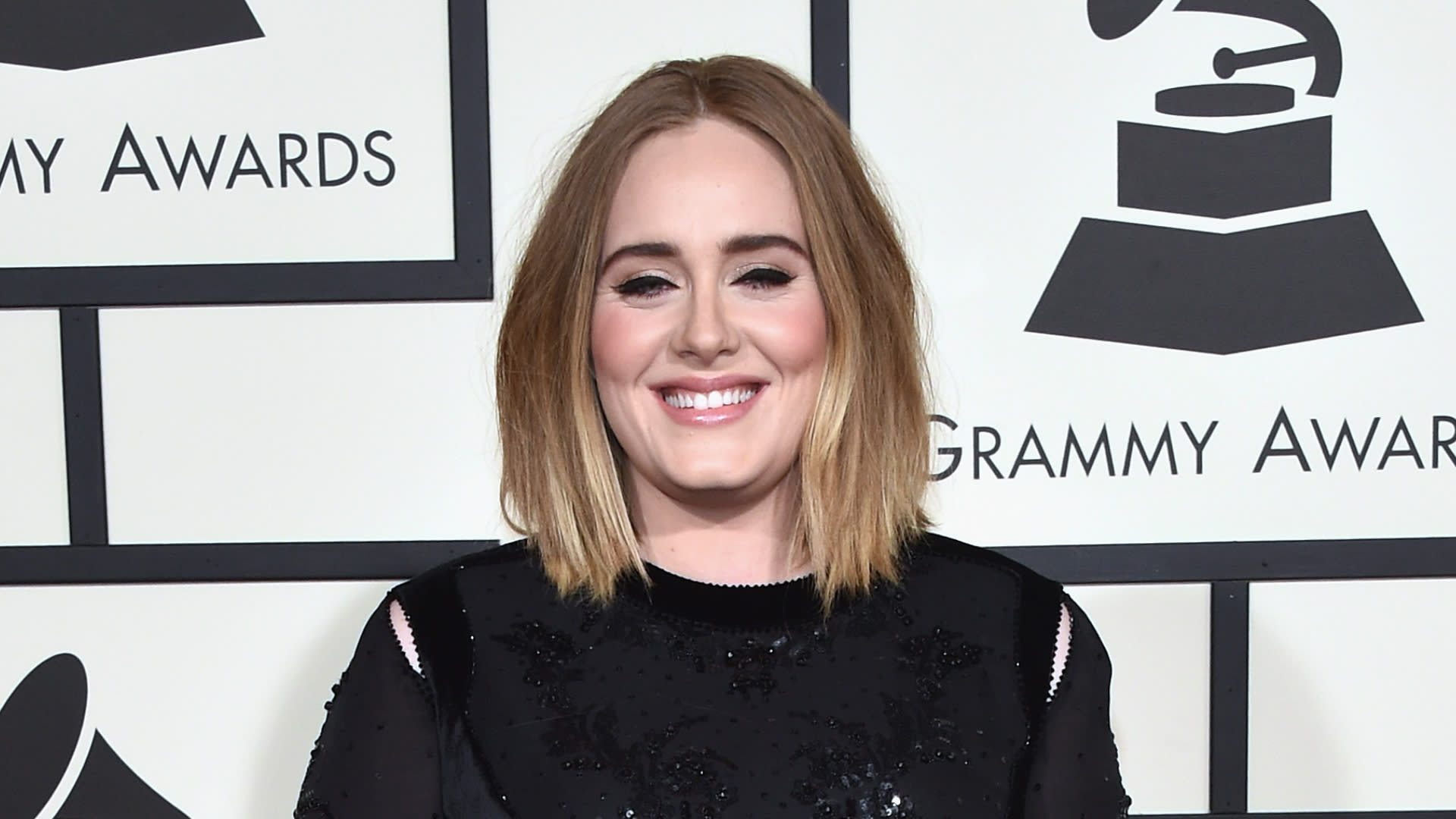 Adele wows in double denim and heels for date night at NBA game