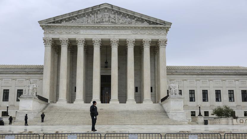 WASHINGTON, DC - OCTOBER 03:  A law enforcement official stands in front of the U.S. Supreme Court Building on October 03, 2022 in Washington, DC. The Court is hearing oral arguments for their first set of cases today which are Sackett v. Environmental Protection Agency and Delaware v. Pennsylvania and Wisconsin. (Photo by Anna Moneymaker/Getty Images)