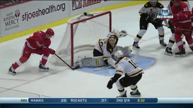 Tomas Tatar dekes around Boston Bruins