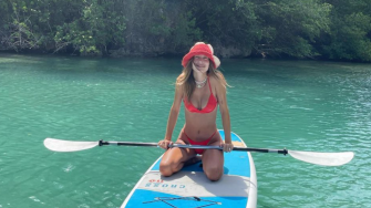 Hailey Bieber shows off her toned figure in a $270 red satin bikini