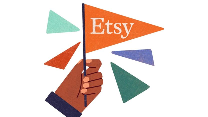 Company illustration showing a hand holding an Etsy flag with the company logo on it. Several other colorful triangles float in the air next to it.