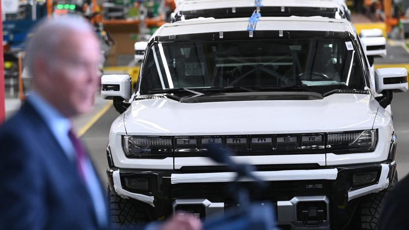 GMC Hummer EVs are seen behind President Joe Biden as he speaks during a visit to the General Motors Factory ZERO electric vehicle assembly plant in Detroit, Michigan on November 17, 2021. (Photo by MANDEL NGAN / AFP) (Photo by MANDEL NGAN/AFP via Getty Images)