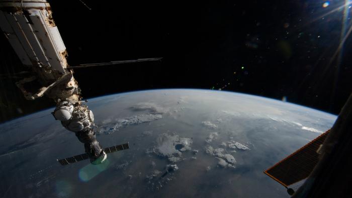 Four main components on the Roscosmos segment of the International Space Station are pictured as the orbital outpost soared 265 miles above a cloudy Pacific Ocean. From top to bottom, are the Nauka multipurpose laboratory module, the European robotic arm attached to Nauka, the Prichal docking module, and the Soyuz MS-23 crew ship.