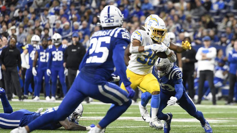 INDIANAPOLIS, IN - DECEMBER 26: Los Angeles Chargers running back Austin Ekeler (30) advances the ball during the NFL football game between the Los Angeles Chargers and the Indianapolis Colts on December 26, 2022, at Lucas Oil Stadium in Indianapolis, Indiana. (Photo by Michael Allio/Icon Sportswire via Getty Images)