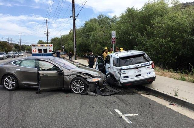 A Tesla sedan is shown after it struck a parked Laguna Beach Police Department vehicle in Laguna Beach, California, U.S. in this May 29, 2018 handout photo.  Laguna Beach Police Department/Handout via REUTERS  ATTENTION EDITORS - THIS IMAGE WAS PROVIDED BY A THIRD PARTY.  BEST QUALITY AVAILABLE.